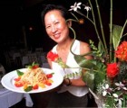 Home Plate: Green Papaya co-owner Anna Shepley brandishes the eponymous Green Papaya Salad, a must-order house specialty.